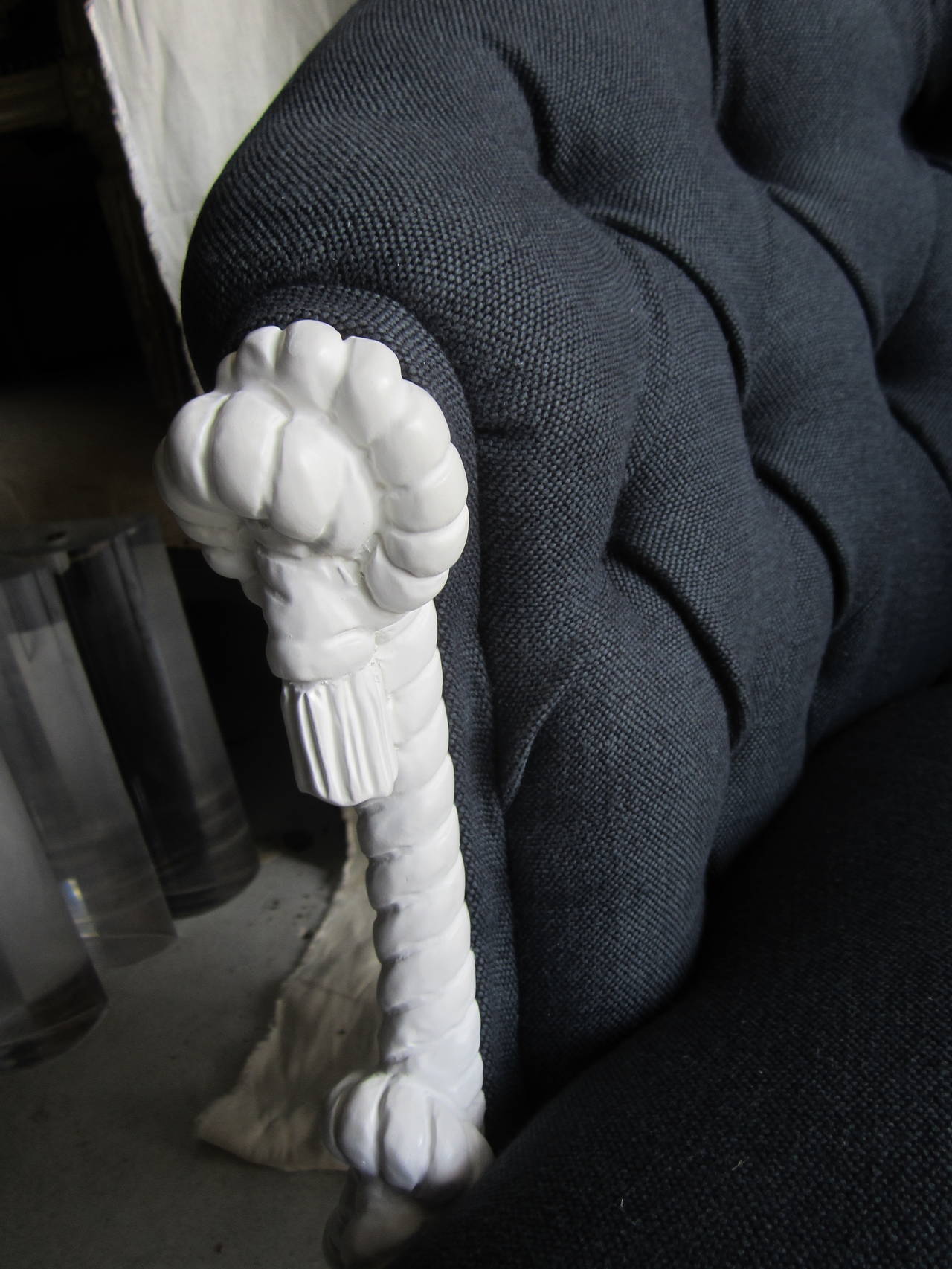 Beautiful rope and tassel chair painted matte white and newly upholstered in navy linen with a tufted back.