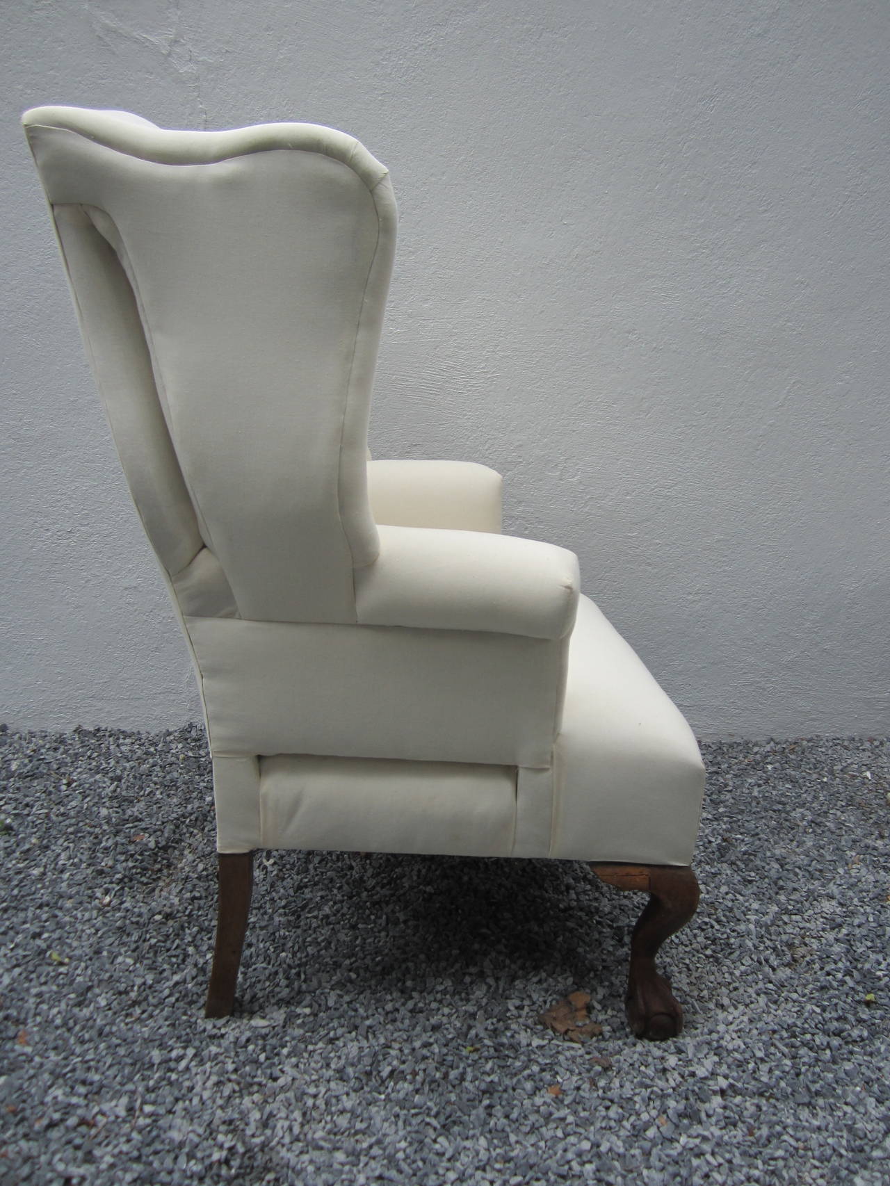 Handsome 19th century wing chair....newly upholstered in muslin.....beautiful ball and claw front legs.....ready for fabric over muslin or leave as is.....great silhouette.....