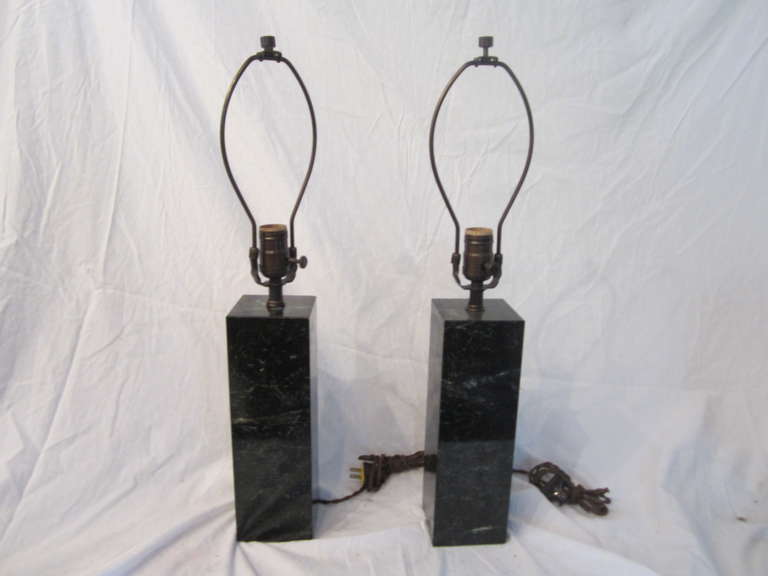 Modern pair of dark green marble lamps. Solid with new silk covered wiring.