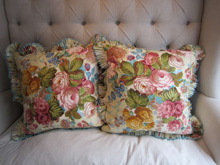 Sumptuous chintz and velvet pillows with triple ruffle trim, all down fill, and hand-sewn.