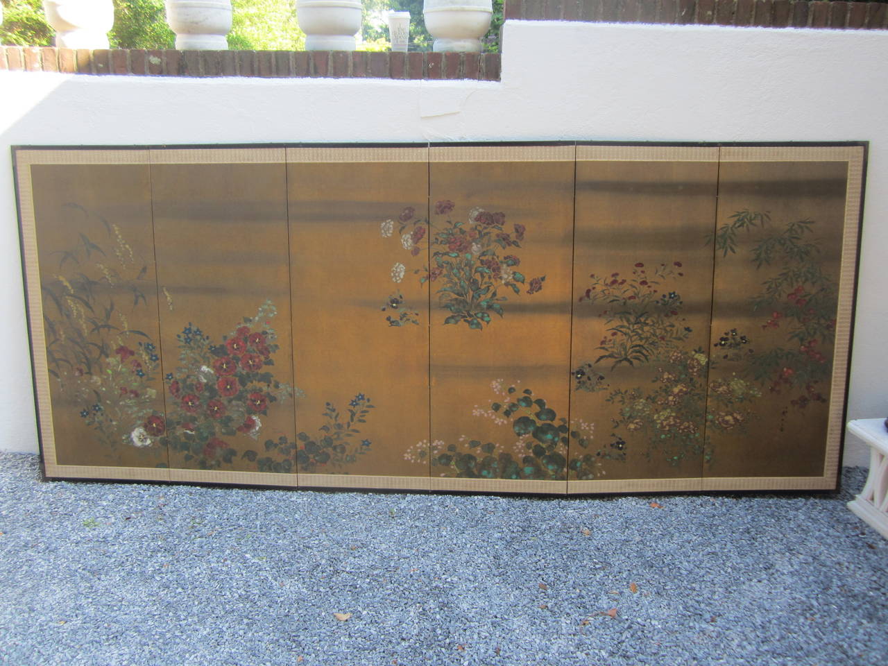 Beautiful six-panel gold foil screen with hand-painted flowers and cloth border.