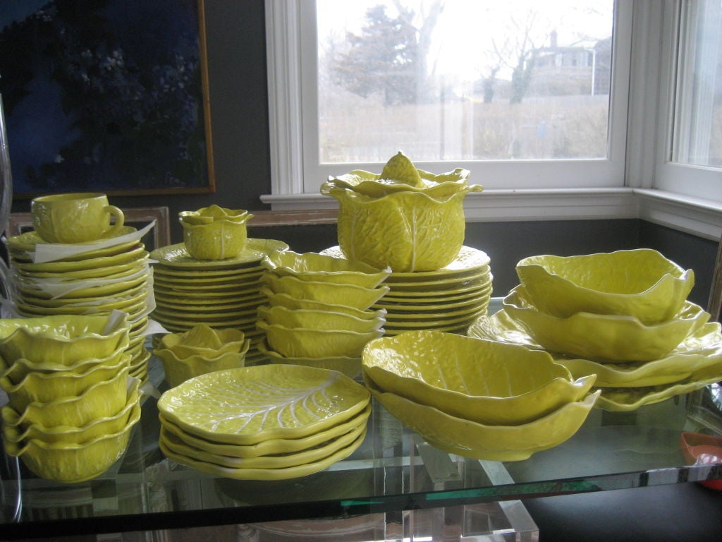 Portugese yellow cabbage patterned set of china....comprised of 21 cups and saucers, 11 dinner plates (10