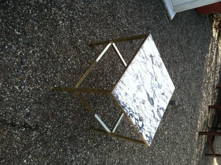 Modern brass frame table with a beautiful marble top