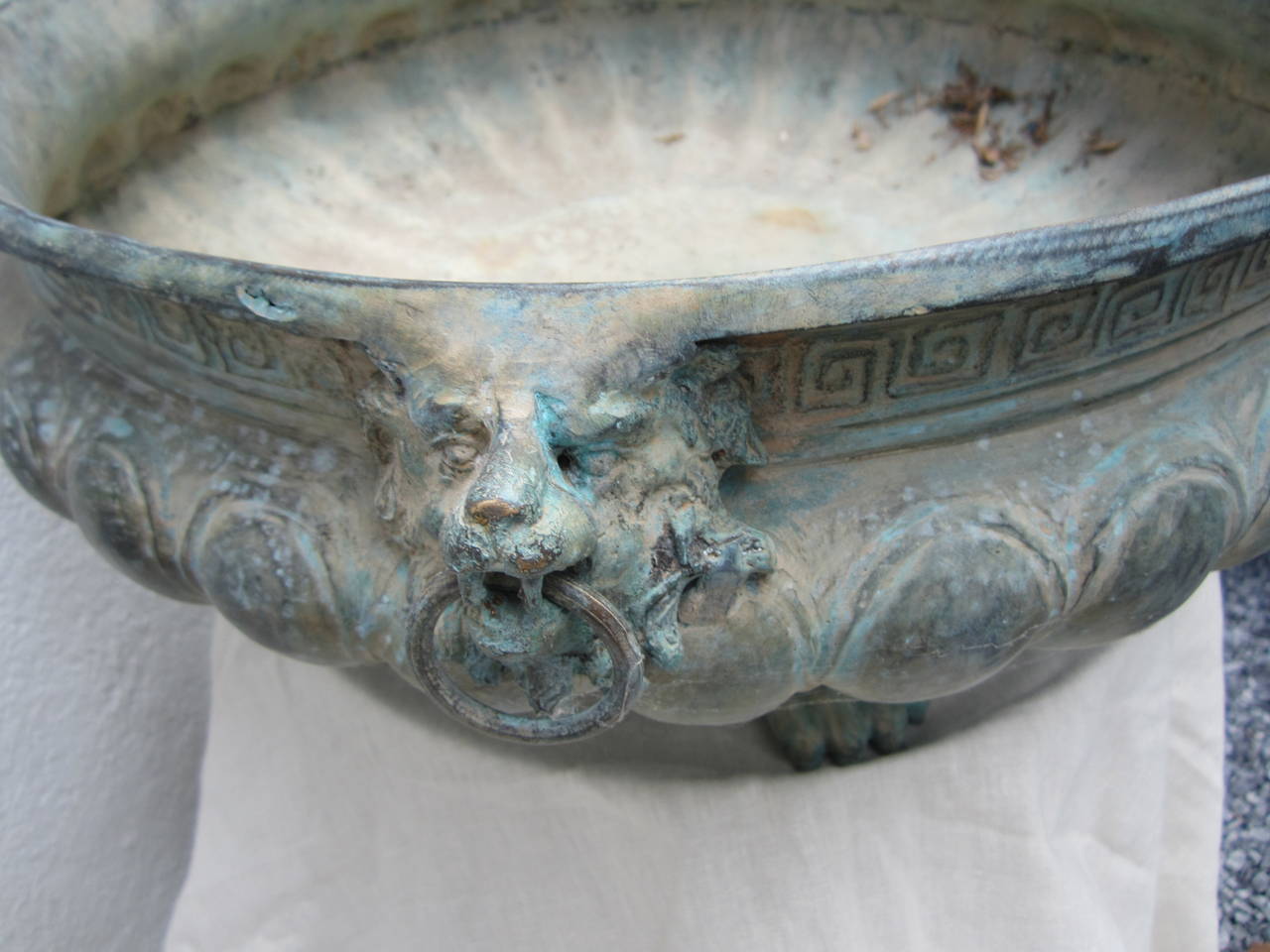 Handsome bronze planter/centrepiece/bowl sitting on four reptile feet with a Greek key border, wonderful green patina.