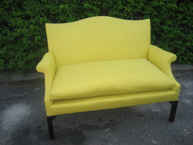 wonderful scale and shape Chippendale style sette/loveseat newly reupholstered in yellow linen with a fat down cushion...