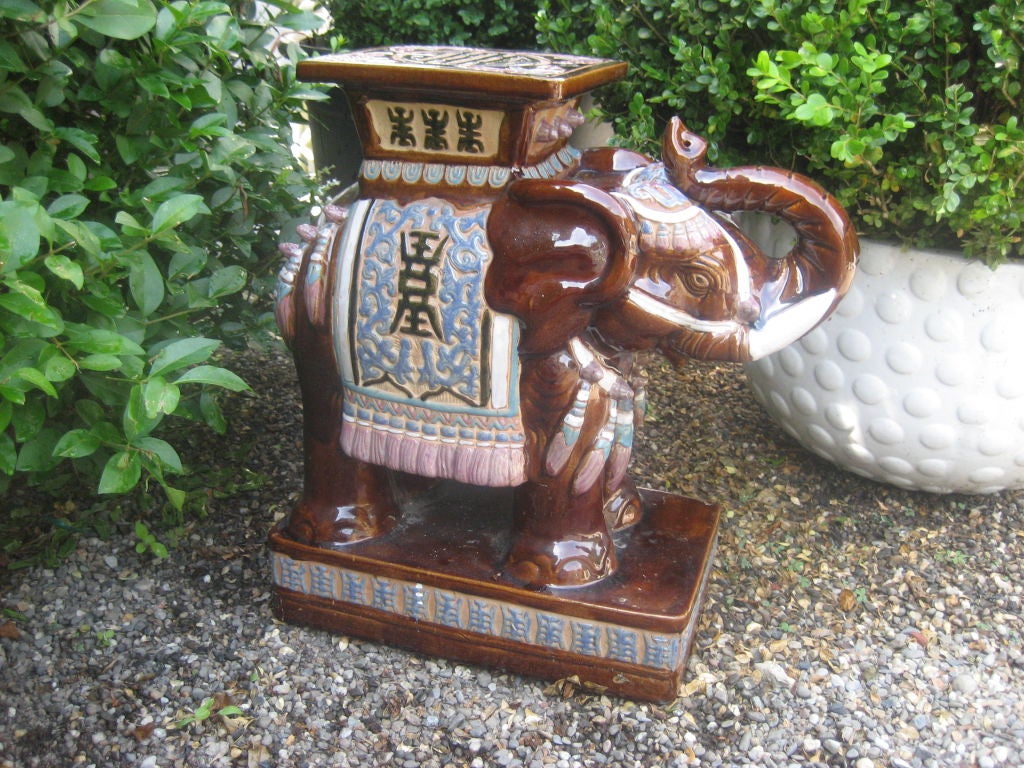 Handsome glazed ceramic Chinese elephant garden table....and good luck with his raised trunk!