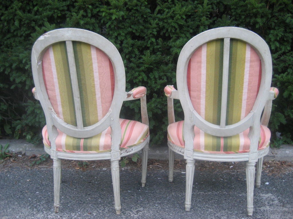 Beautiful pair of 19th century fauteuils with lovely gray painted frames....an exquisite pair of chairs....