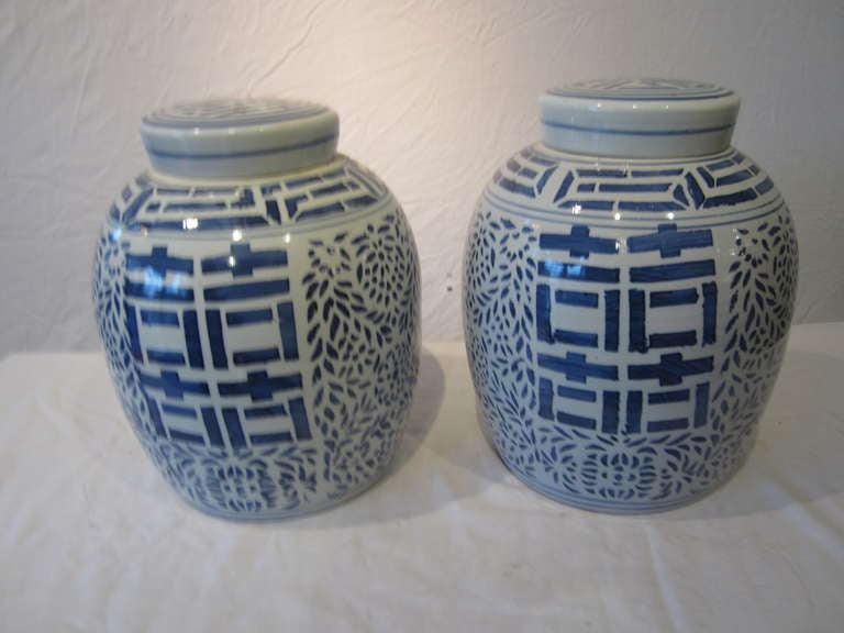 20th century Chinese blue and white porcelain jars with lids.