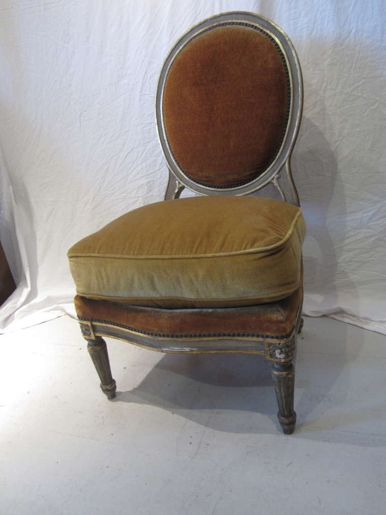 Maison Jansen boudoir chair in the Louis XVI style.....painted grey and gilt wood finish....upholstered in original mohair....wonderful patina!
