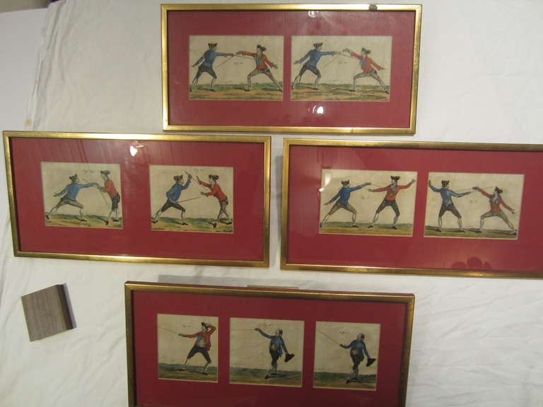 Set of four framed hand-colored prints depicting fencers, 18th century, English... In gold frames.