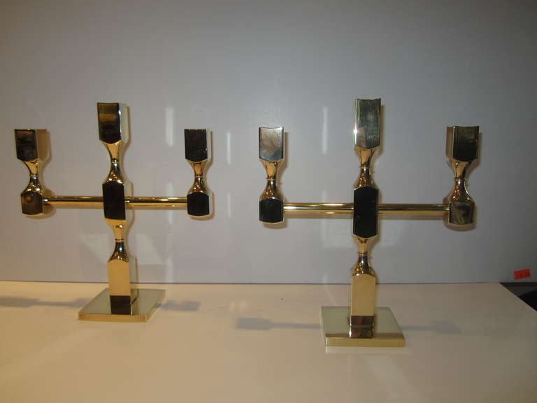 Handsome pair of brass Gusums Bruk candelabras. Stamped Metallslojden/Gusum/Made in Sweden. Also numbered on each.