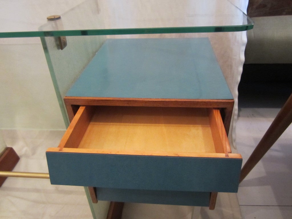 A desk for the Verocoke offices, Milan, 1939. Gio Ponti Desk from the Societa Vetrocke Building, Milan, ca. 1939. Vitrex Glass, laminate, Italian walnut, enameled steel, and brass. 

Recently exhibited at 