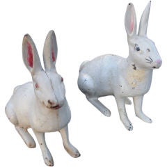 Two vintage cast iron rabbits