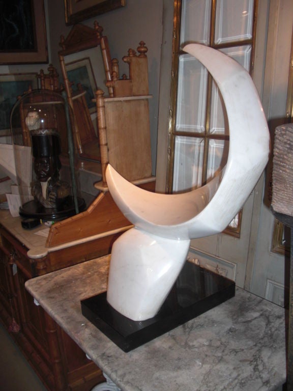 A large and very handsome carrara and black marble abstract sculpture in the form of a crescent moon by artist Catherine Catchi Childs circa 1970. Signed 