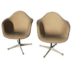 Two Herman Miller swivel chairs with original Girard fabric