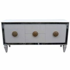 1940
s credenza with mirror inserts and silver leafed pulls