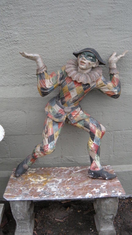 A large and rare , wonderfully whimsical 19th century Venetian carved, polychromed and silver leafed wood harlequin figure. It could be French so maybe we