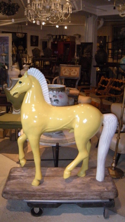 A terrific and very large bright yellow Greek style Italian majolica horse on a wood base circa 1950 (or earlier).I imagine that dealers or scholars will know exactly who this sculpture is by....somebody like Gambone or many others. It has several