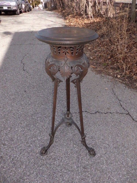 A beautifully designed and cast patinated bronze grand tour / classical style french tripod pedestal circa 1860-1880 with paw feet, acanthus leaves details etc... This pedestal is stamped with undecipherable initials ( G.G???) several times on the