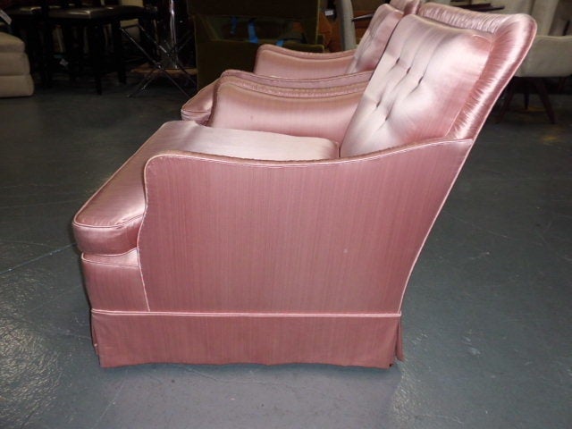 A quality pair of vintage 1940's/1960's upholstered armchairs of very generous proportions with tufted backs and down cushions. The original upholstery , an off pink satin is in pretty good and possibly useable condition however we are selling the