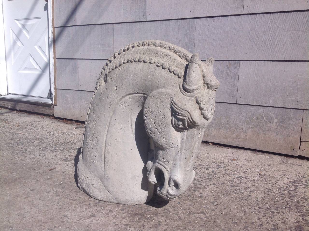 A very handsome vintage cast concrete horse head.