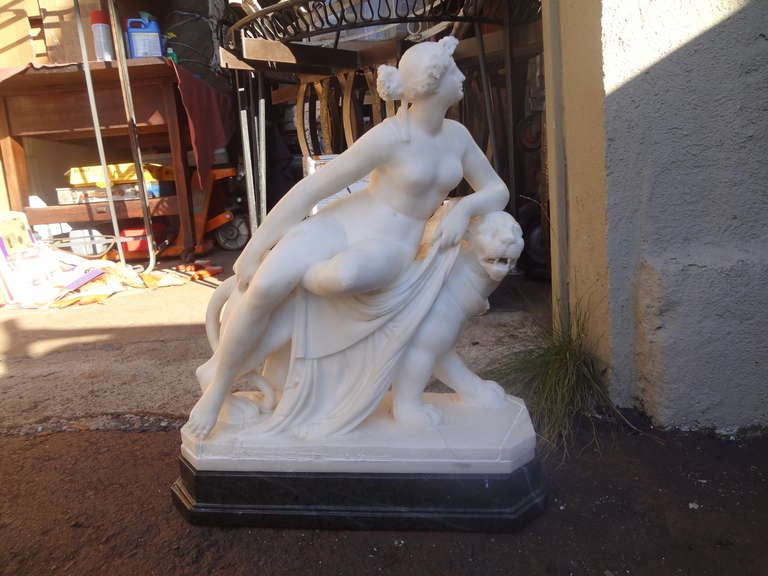 A beautifully and crisply carved 19th century, probably Italian, alabaster sculpture of Ariadne and the panther after an Antiquity original. Sits on its original, but separate green marble base. Several old repairs on the alabaster base, not on the