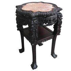 A great carved Cinese hardwood stand with inset marble top