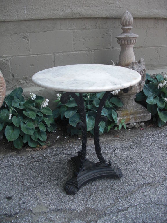 A pretty rare American cast iron and marble garden table or gueridon. Pre civil war , it is a pretty rare table . Another example can be found on The New Orleans Auction 