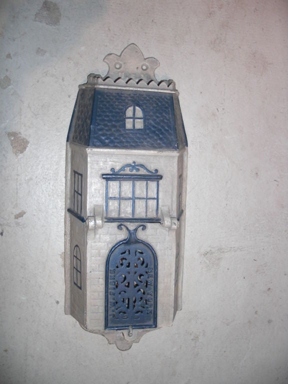 An unusual 19th century American cast iron mailbox in the form of a house by renowned foundry J.W Fiske. It is stamped 