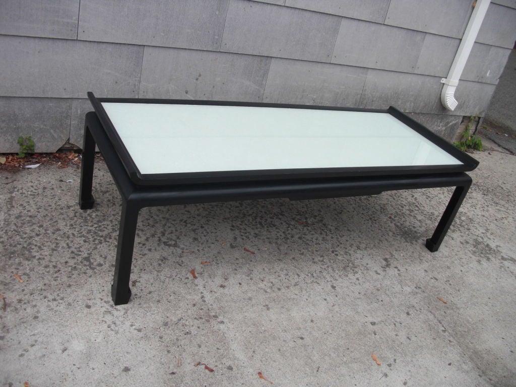 A very chic and good size Asian style coffee / cocktail table with an unusual reverse painted glass top meant to immitate moonstone or opal (see detail photo)