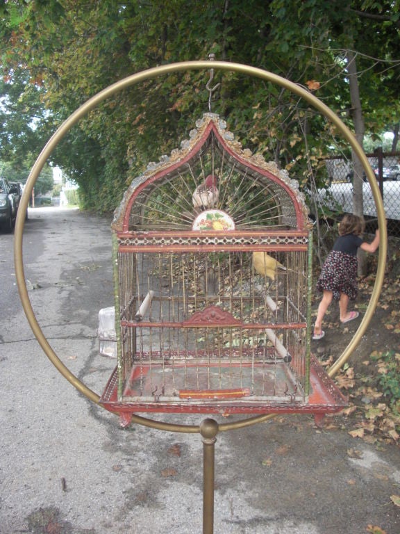 A pretty great American Victorian birdcage in it's original iron and brass stand. I know better than to offer something so old fashioned as a bidcage and stand but you will look long and hard to find a better example in better condition. How about