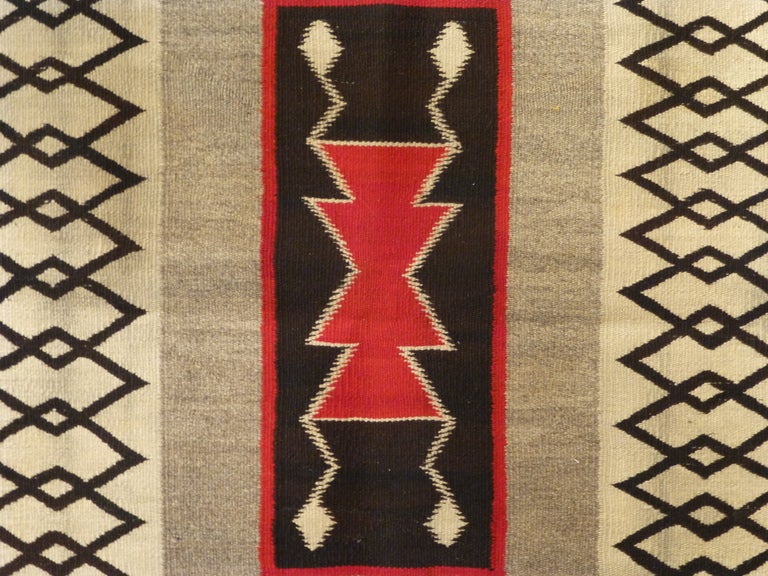 Finely woven Navajo rug with unusual graphic design.  American.  Circa 1920.  