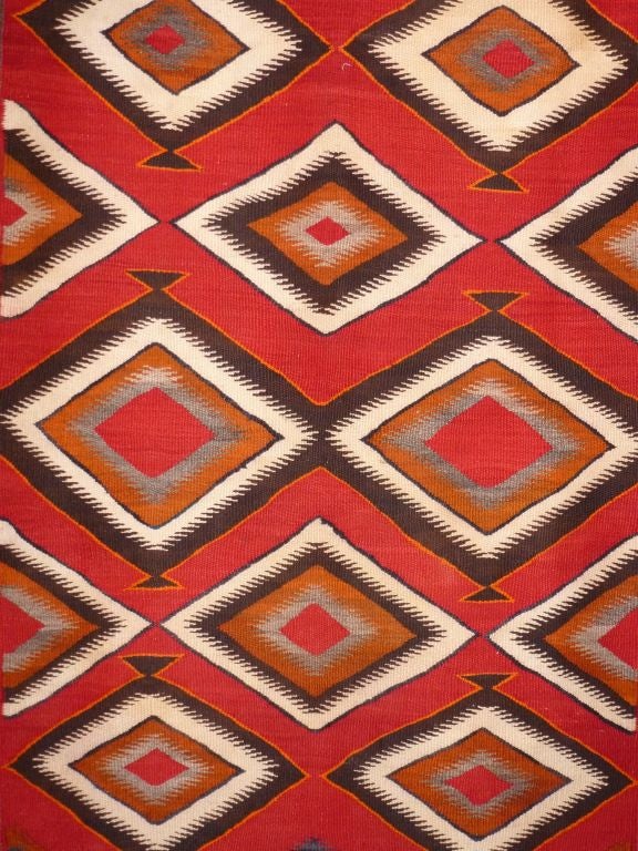Navajo rug with unusually rich colors, beautifully woven in mint condition.  Bold, graphic design.