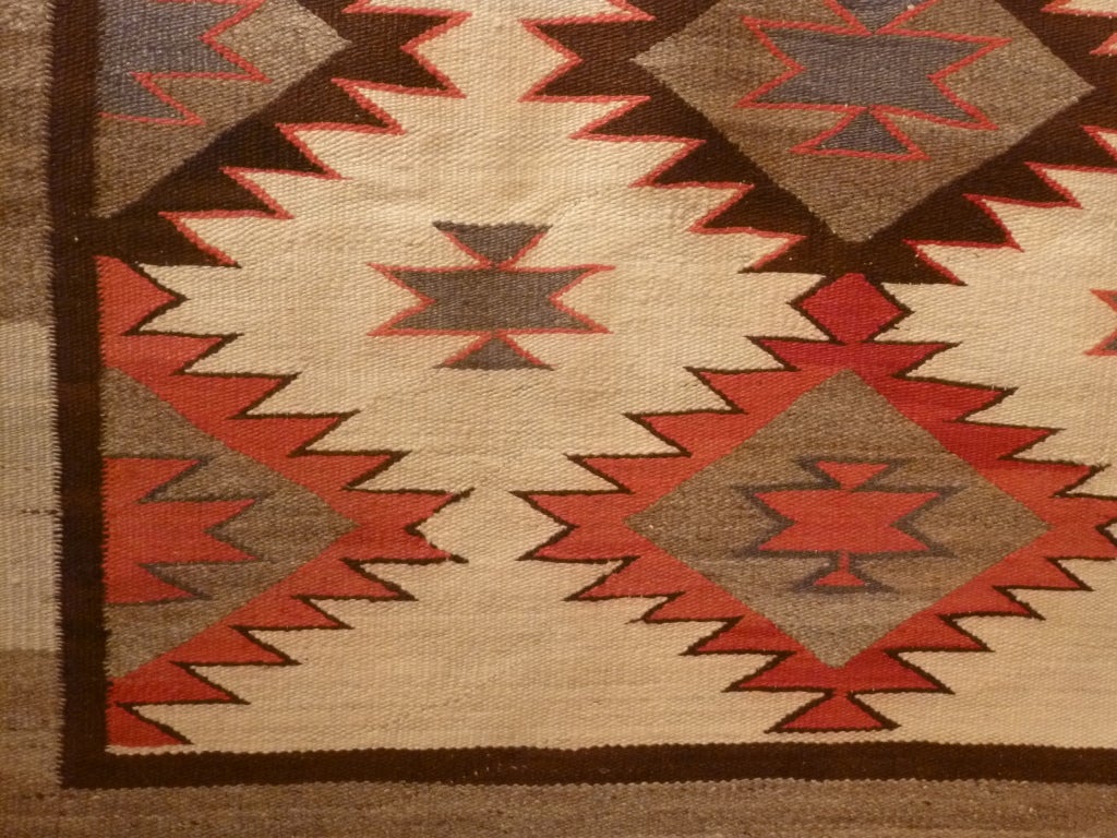Finely woven Navajo Rug with geometric design and unusual colors.