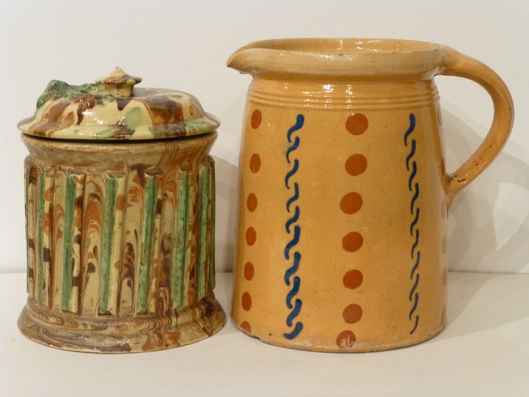 Eight pieces of French country jaspe pottery.  This pottery originates from the Savoie region of France and dates from the late-19th to the early-20th century.  The traditional glazed treatments, called jaspe, are usually marble-like swirls of
