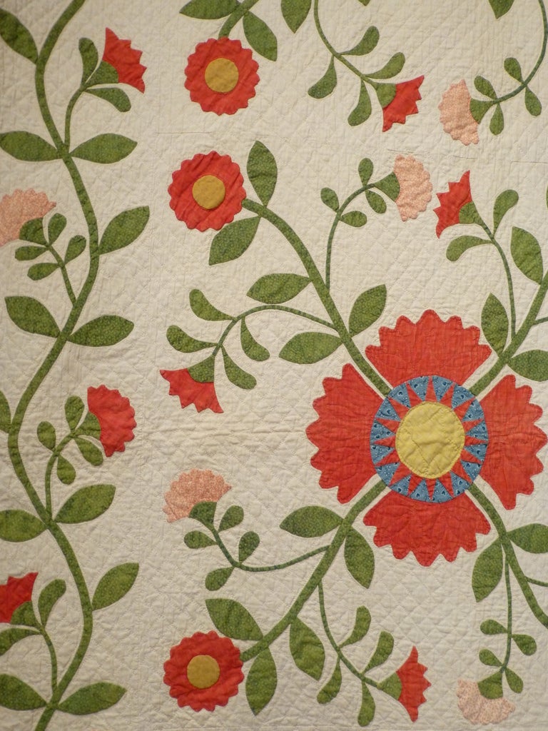 Coxcomb and Rose Applique with Pieced Sunbursts and Vine border.  Third quarter of the 19th-Century.  Traditional applique quilts from the 19th-Century represent a high point in the history of American textile arts.  This prime example shows