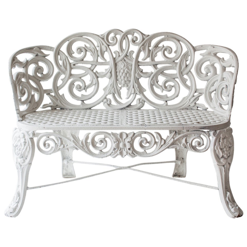 An American cast iron Garden Bench, known as the"Scroll Settee" circa 1900.