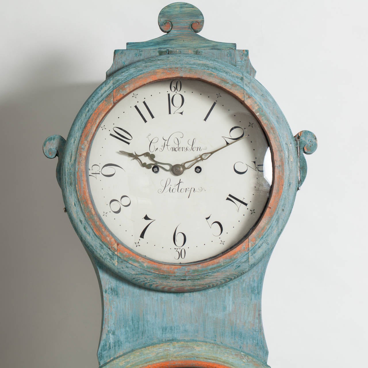 A beautiful Mora clock in the original blue paint surface with details of pale yellow/ gold and coral. The door of the clock has the initials of the owner as well as the date ,1835. The face is signed with the name of the town in which it was made