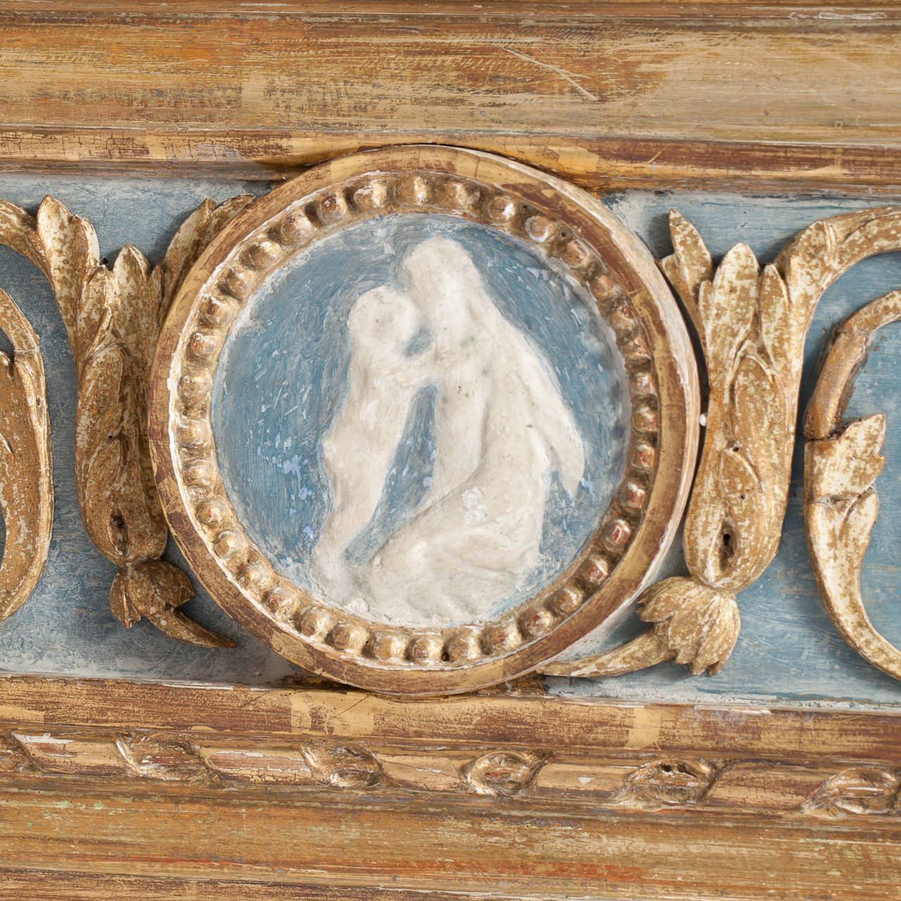 This Swedish Gustavian period mirror is a great example of the work of well-known Stockholm maker Eric Wahlberg (1760-1811). It is signed with his initials on the back. The mirror, in beautiful untouched giltwood has a carved bow at the crest and a