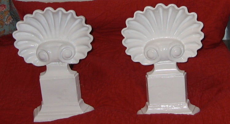 A pair of Andirons in the form of shells. Heat resistant enamel.