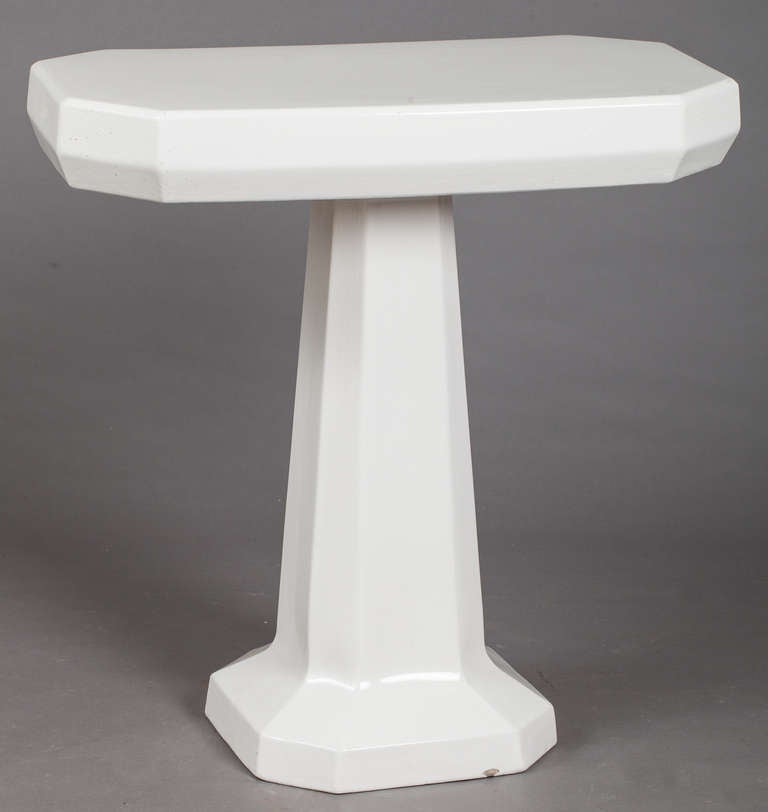A white porcelain pedestal table in two parts in excellent condition, France, circa 1900. Tables such as these were often used in a bathroom as a place to display fragrances and jewelry or with the addition of a mirror as a dressing table.