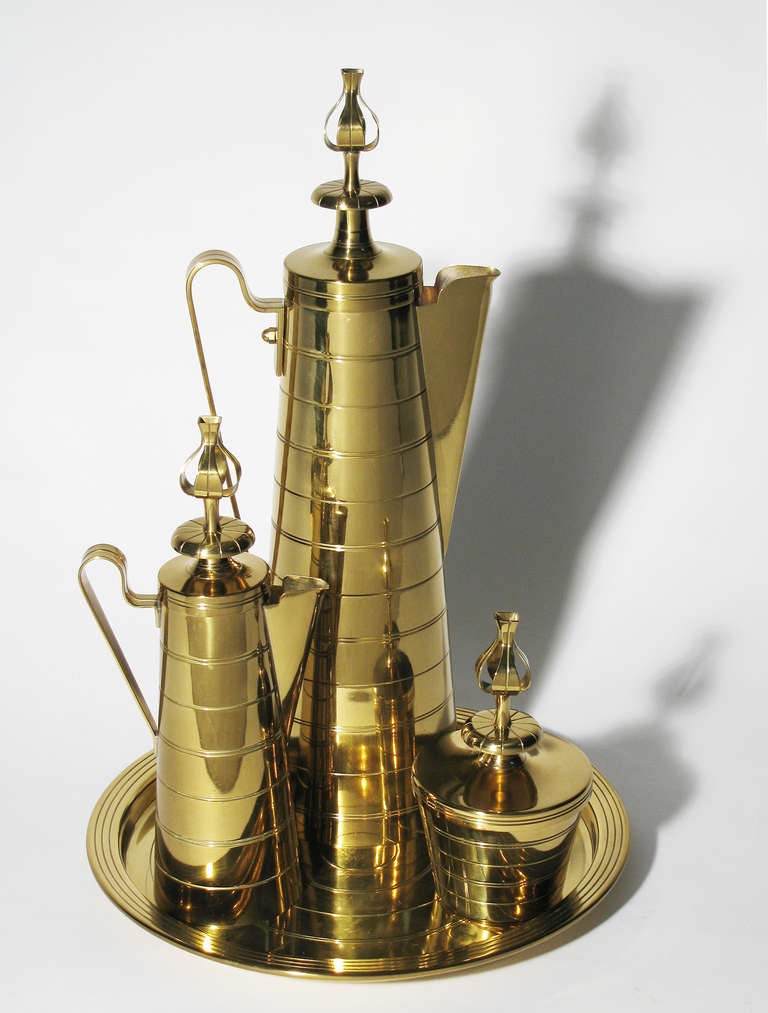 A stunning four piece brass coffee service by Tommi Parzinger. Each piece marked Dorlyn Silversmiths. A complete set depicted as originally designed.
