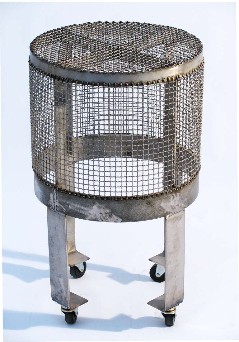 A custom designed steel cage side table or drinks table with wheels. Designed by Blackman Cruz, Los Angeles.