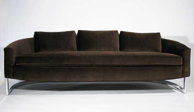 A sleek and sexy velvet and chrome cantilevered frame sofa by Milo Baughman. The foundation as well as the velvet upholstery is new. The seat cushion is loose and down-wrapped, as are the three loose back pillows. The velvet is 