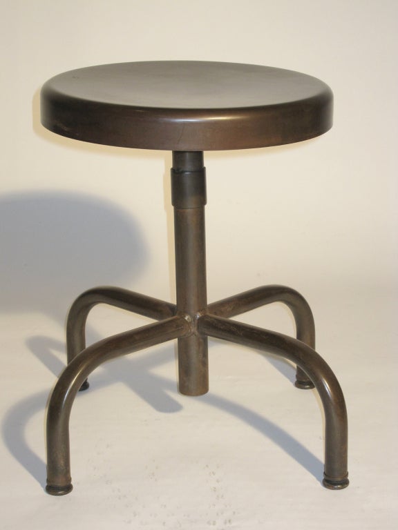 A set of six American-made Industrial Stools, circa 1940's.
Adjustable height is achieved by a special mechanism
inside the base when pulled to desired height,
then locks in place.
All stools have a custom applied dark bronze finish.