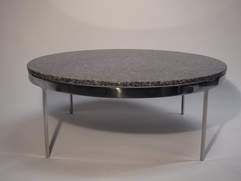 A stunning Nicos Zographos table with a granite top, gray in color with flecks of blue on a highly polished steel base. This perfect 36