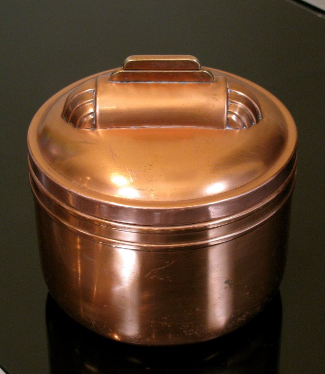 A Deco period copper humidor has a removable canister inside the lid.