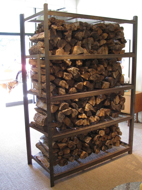 Impressive scale industrial steel rack for firewood or many other uses. This heavy gauge steel rack is displayed with 1/3 cord of California white oak firewood. The warm patina on the steel with the firewood makes a nice divider for a large