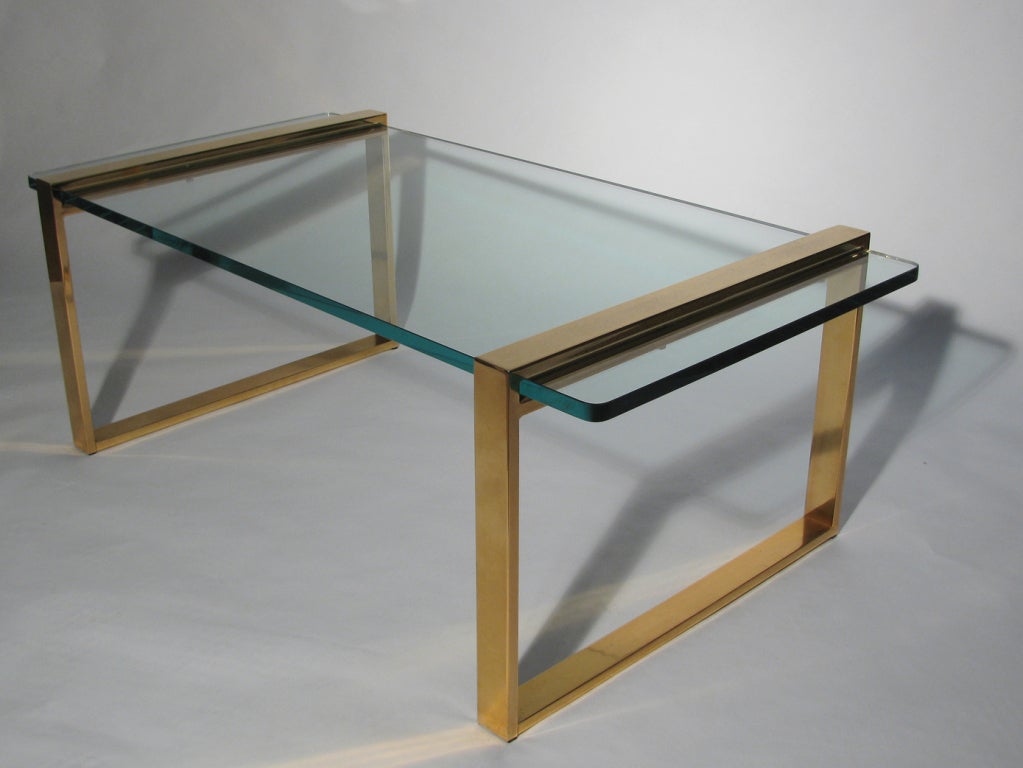 A modernist style brass coffee or cocktail table with 3/4