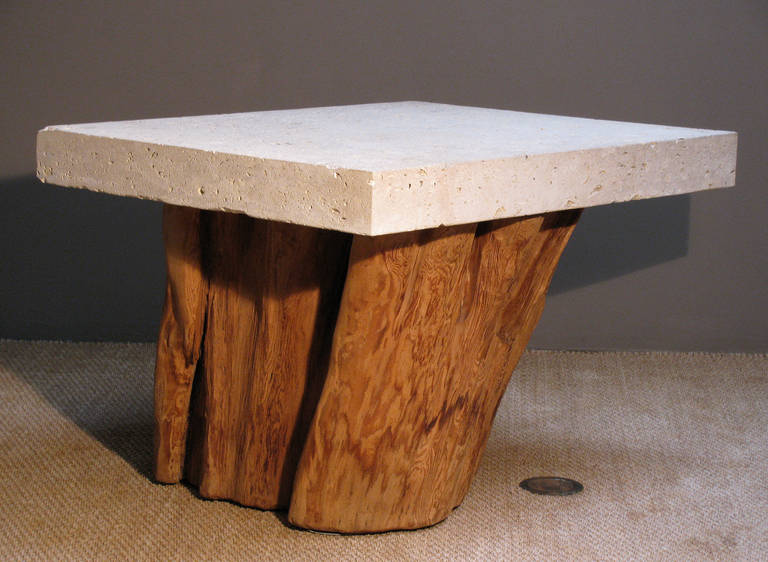 A large console or center table designed by Michael Taylor with his signature fossil stone (Limestone) top; 4.75